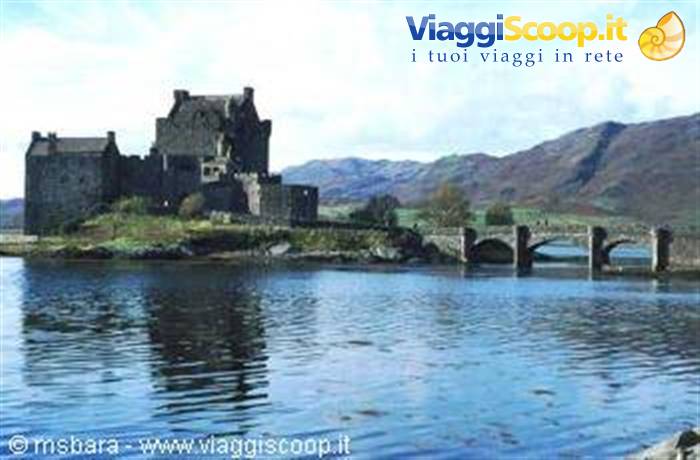 Eilean Donan stone castle with arched bridge over the loch