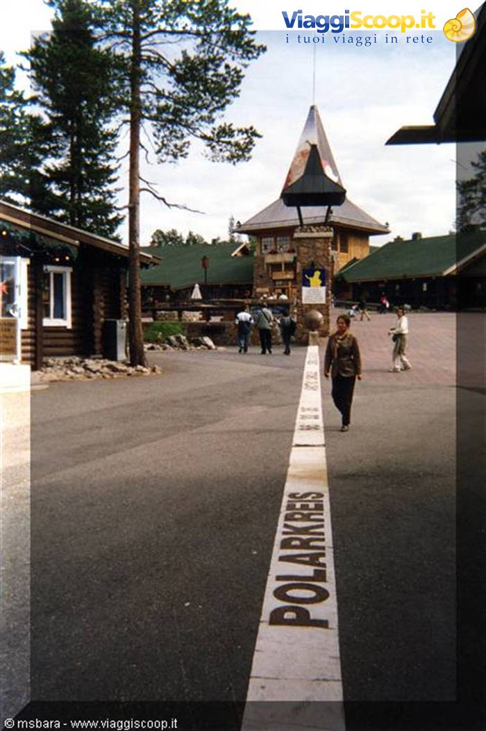 Girl walking on the Arctic Circle line at Santa Claus Village, Rovaniemi