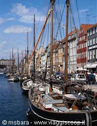 Nyhavn in Copenhagen: old sailing masts along the colorful canal