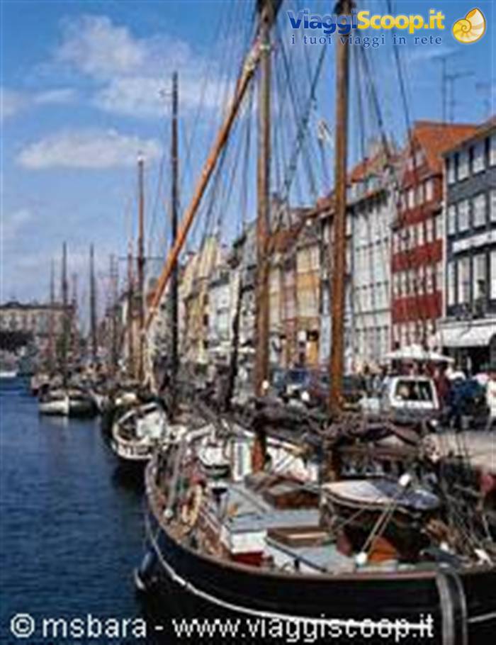 Nyhavn in Copenhagen: old sailing masts along the colorful canal