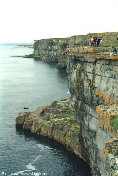 Tourists on the limestone cliffs of Inishmore, Aran Islands