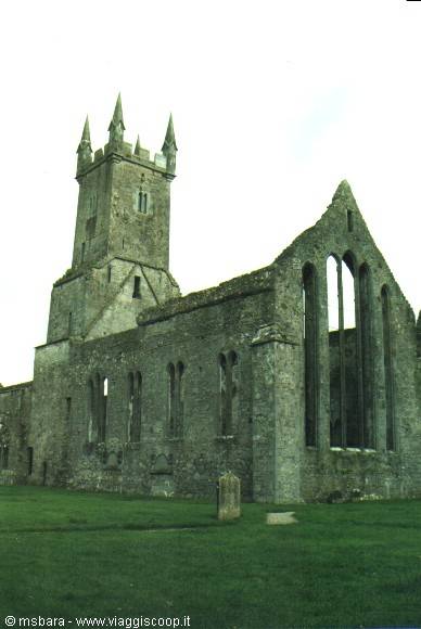 ruins of old stone church with bell tower and tall gothic windows