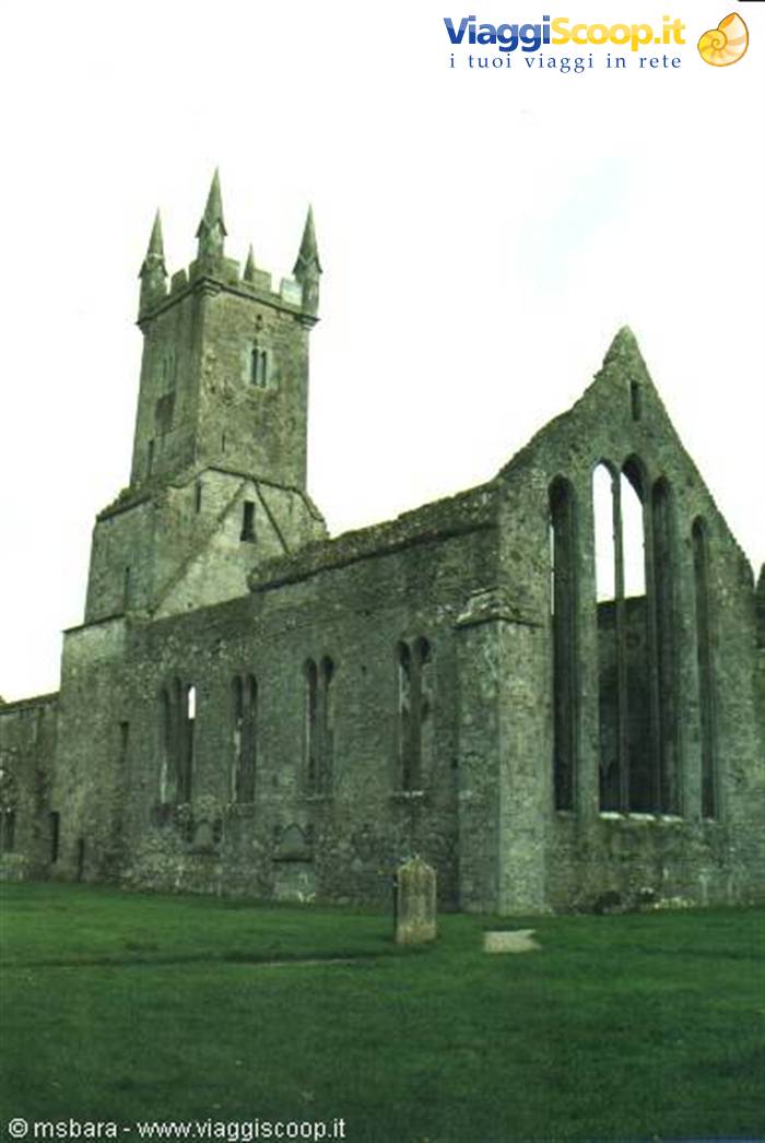 ruins of old stone church with bell tower and tall gothic windows