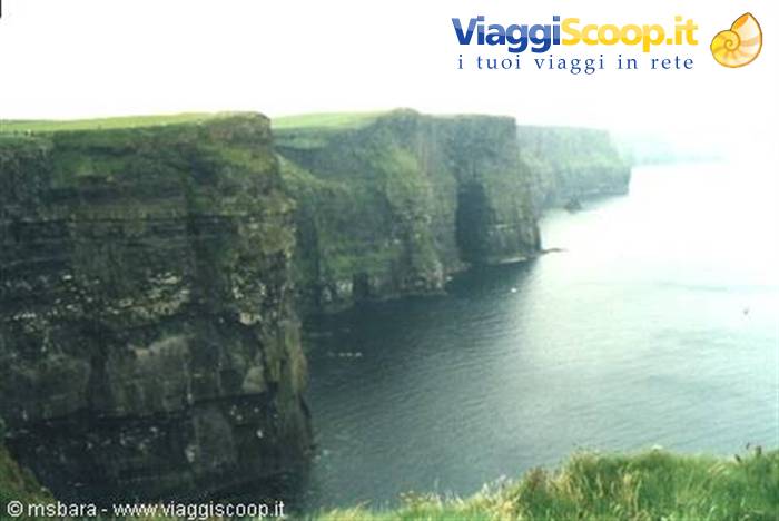 The Cliffs of Moher, sheer rock walls above the misty ocean