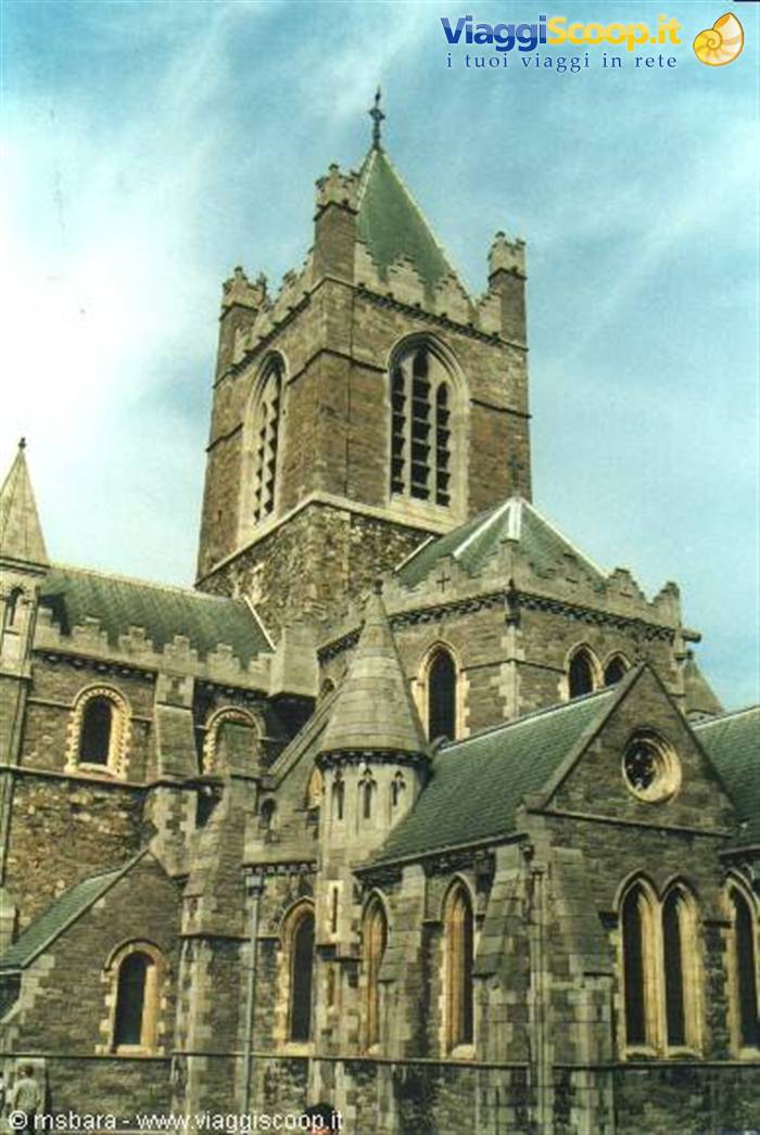 Christ Church Cathedral in Dublin, grey stone tower under clouds