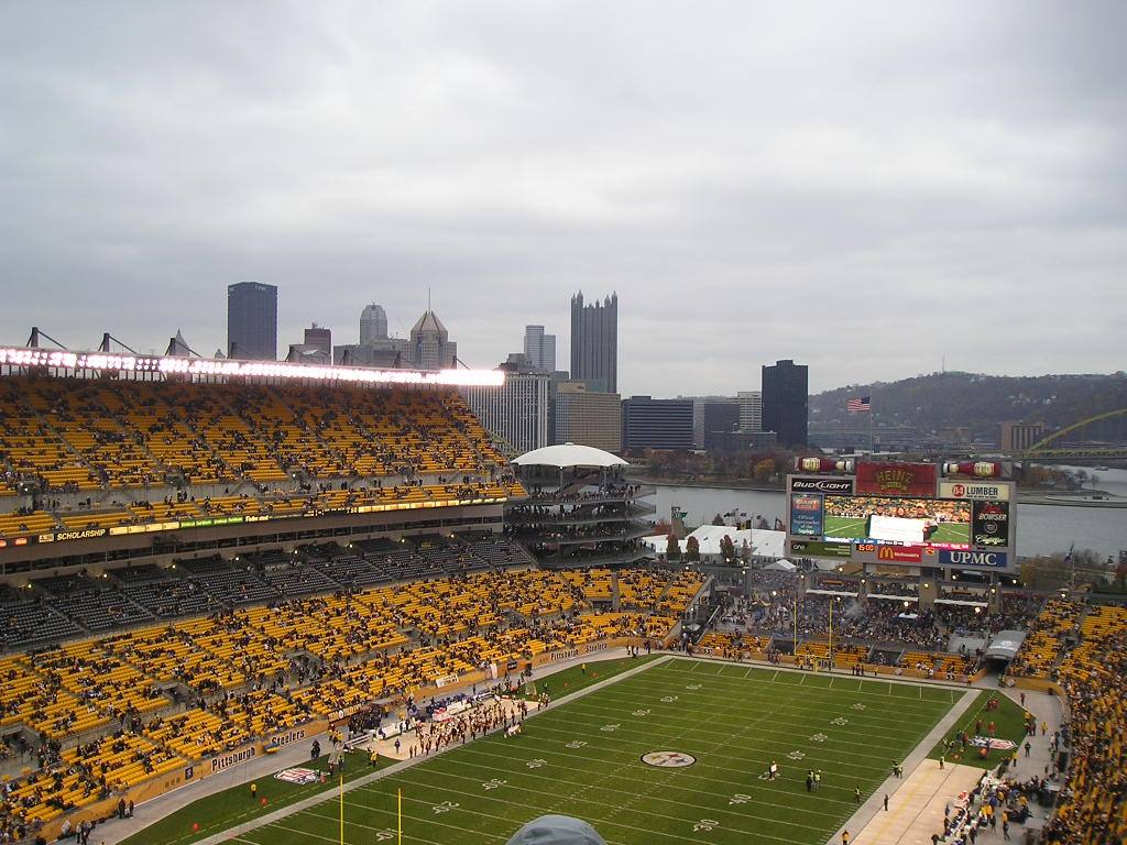 Heinz Field in Pittsburgh, black and gold fans, football field, gray sky