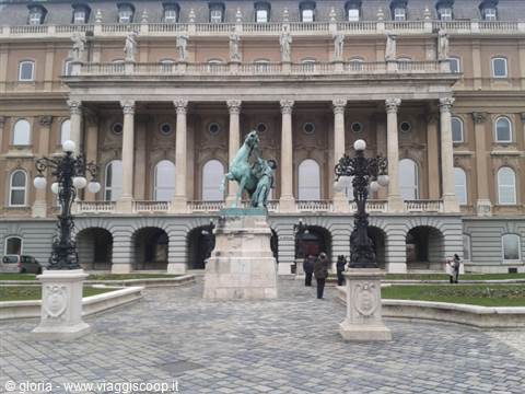 Buda Castle courtyard with bronze equestrian statue and wrought iron lampposts