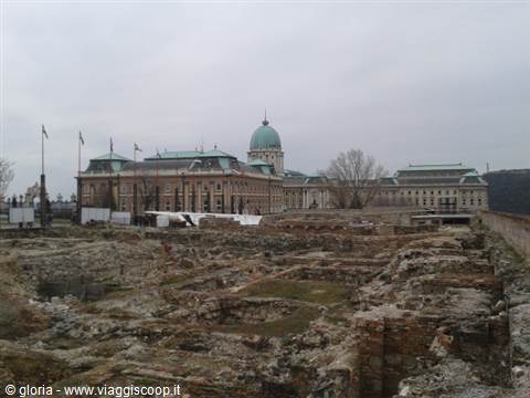Medieval ruins in front of Buda Castle under a grey sky