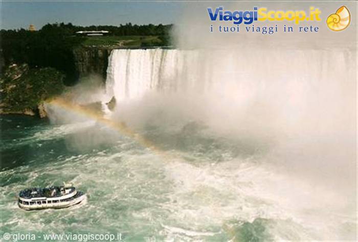 Niagara Falls, tourist boat in mist and rainbow near the falls