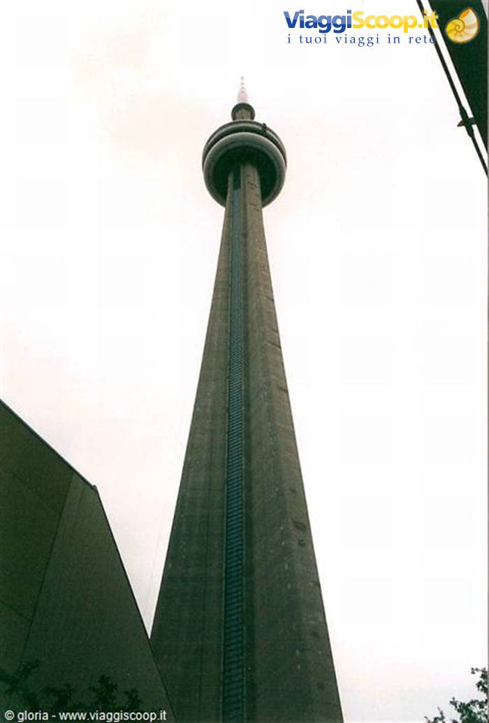 The CN Tower in Toronto seen from below against a white sky