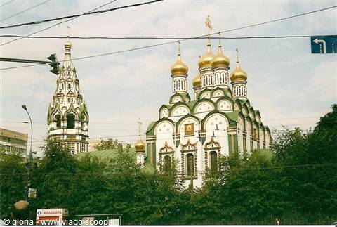 Orthodox church with golden domes, white and green walls, baroque bell tower, Moscow