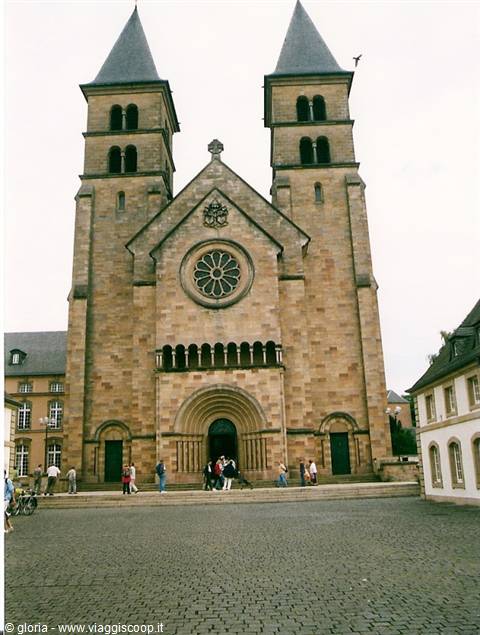 Echternach basilica: Romanesque stone facade with twin towers and rose window