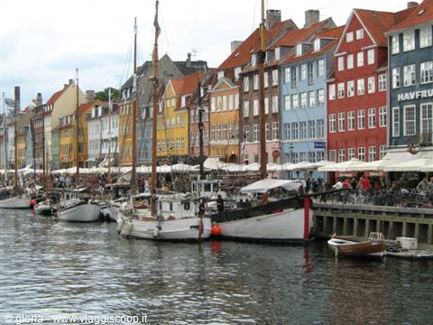 Nyhavn in Copenhagen: white boats moored in front of colorful houses