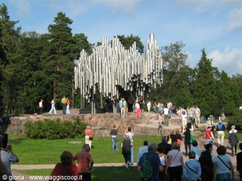 Sibelius Monument in Helsinki, steel pipes among tourists and green trees