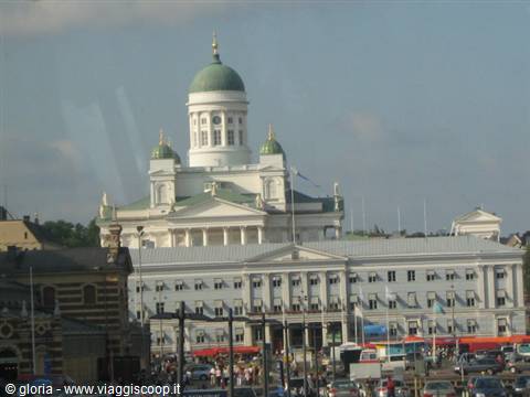 Helsinki Cathedral white with green dome overlooks the busy square