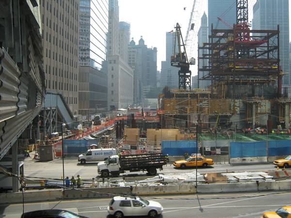 Ground Zero construction site in New York, cranes and yellow taxis among skyscrapers