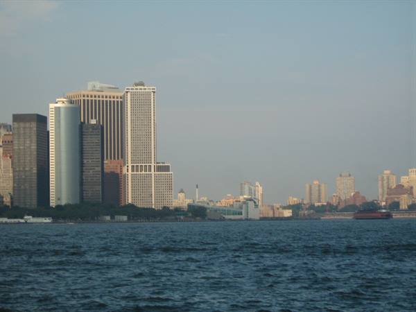 Manhattan skyscrapers from the ferry, choppy water, hazy light