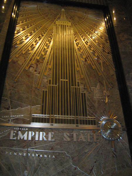 Aluminum relief of the Empire State Building on marble, warmly lit
