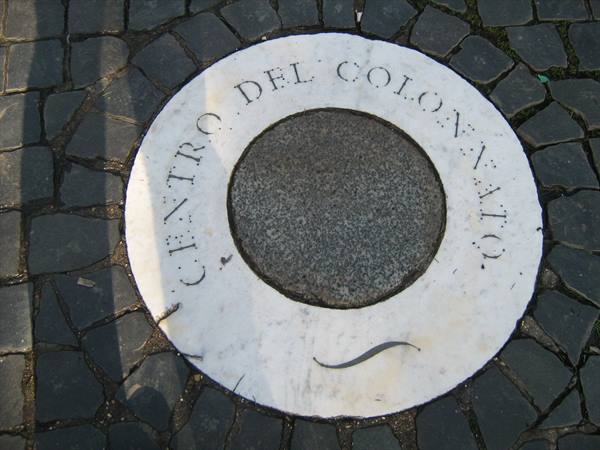 Carved marble disc reading Centro del Colonnato set in cobblestones