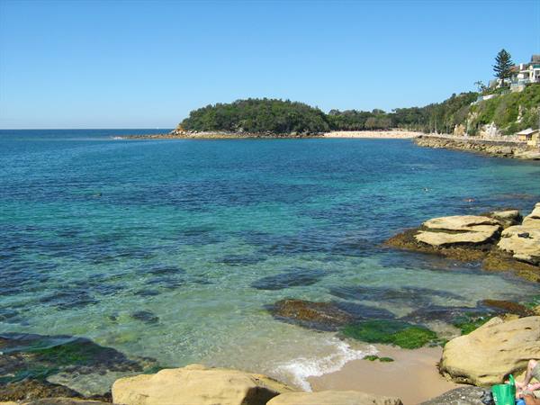 Turquoise water over sand and rocks at Shelly Beach, Sydney