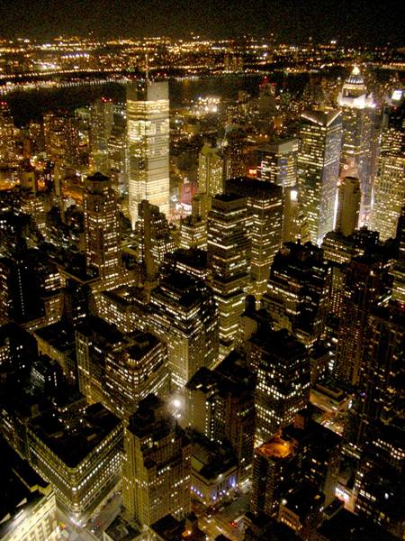 New York skyscrapers glowing at night seen from the Empire State Building
