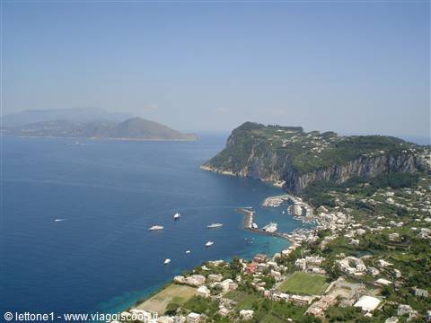 Marina Grande in Capri: white boats in the harbor beneath limestone cliffs
