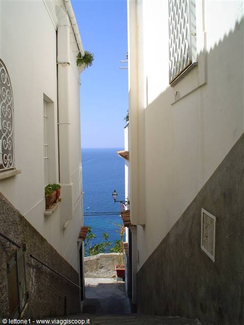 Stairway between white houses leading to the sea, Sperlonga