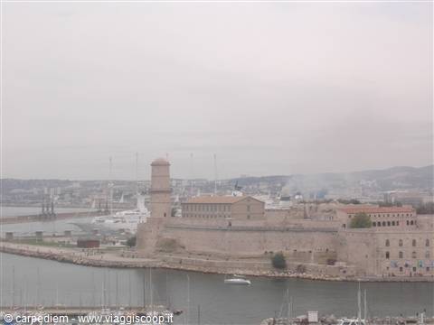 Fort Saint-Jean overlooking Marseille harbor and marinas under a grey sky