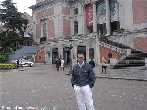 Tourist in denim jacket in front of the Prado Museum entrance, Madrid