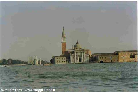San Giorgio Maggiore church with bell tower seen from the water, Venice