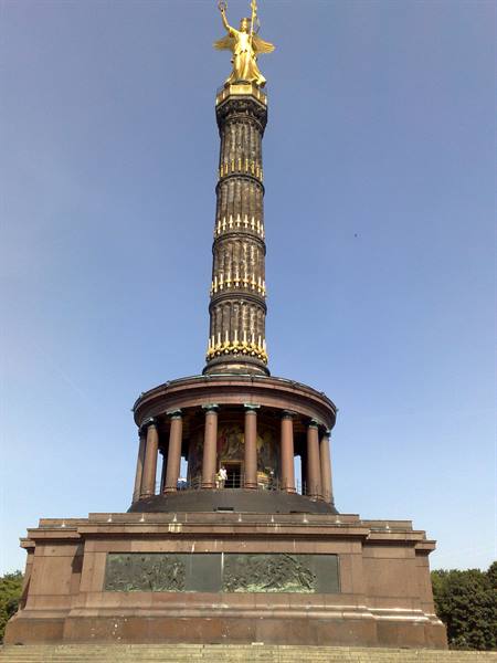 Berlin Victory Column, golden winged Victory statue against a clear blue sky
