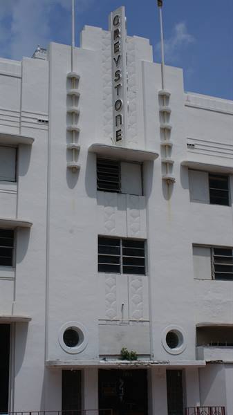 White Art Deco building with vertical Greystone sign, Miami Beach
