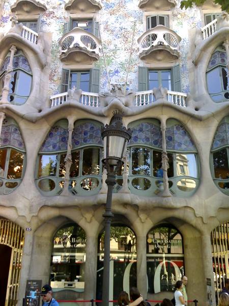 Gaudí's Casa Batlló facade in Barcelona, curving stone and colorful stained glass