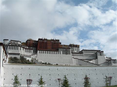 Potala Palace in Lhasa, white and maroon walls under cloudy sky