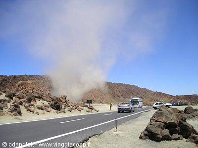Tourists photographing steam along the volcanic road of Teide