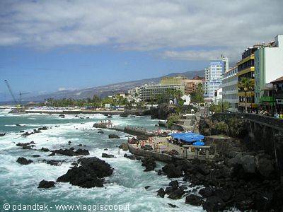 Waves on black rocks in front of Puerto de la Cruz hotels, Tenerife