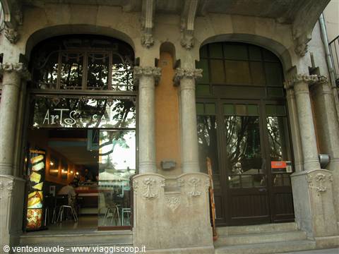 Carved stone facade with columns and arches at the Art Nouveau cafe entrance
