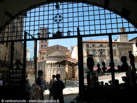 Piazza Grande in Arezzo seen through the glassed Loggia del Vasari