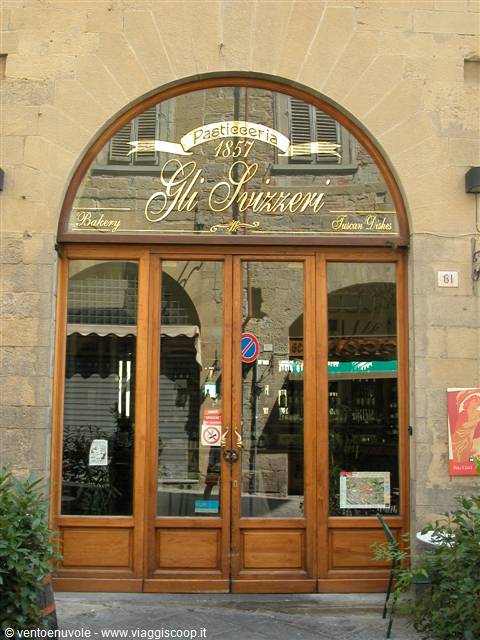 Wooden entrance of Gli Svizzeri bakery founded in 1857, Tuscany