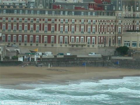 The Grand Hôtel in Biarritz overlooks the beach with ocean waves in front