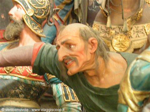 Paper-mache statues of a helmeted knight and a shouting old man