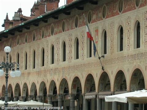 Frescoed facade with arched loggia and Italian flag, Piazza Ducale Vigevano