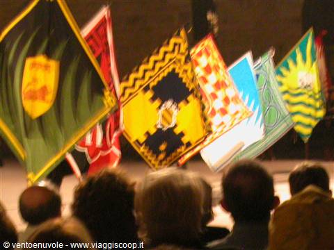 Heraldic flags waved during an evening performance before the crowd
