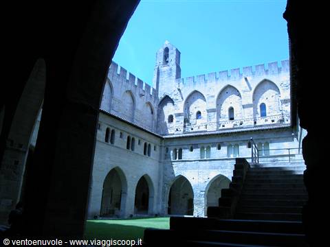Inner courtyard of the Papal Palace in Avignon, stone arches and stairs