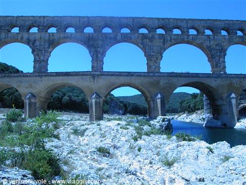 Pont du Gard: Roman stone aqueduct over the Gardon river, blue sky