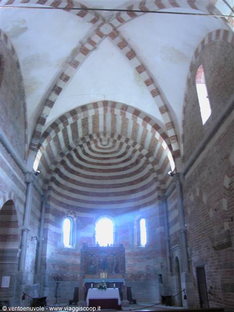 Red and white striped apse inside the Romanesque church of Santa Maria di Vezzolano