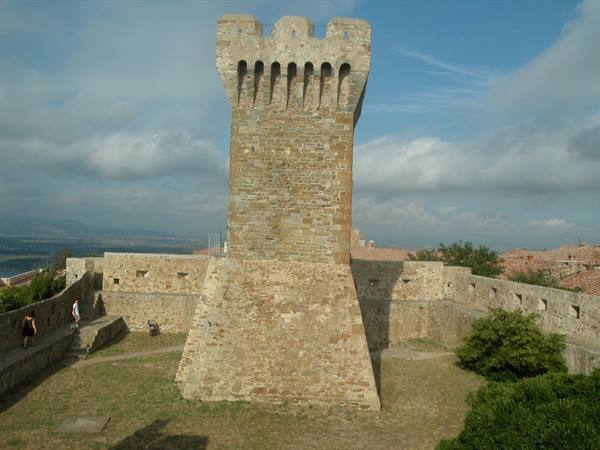 Stone tower with Guelph merlons on the walls of Populonia