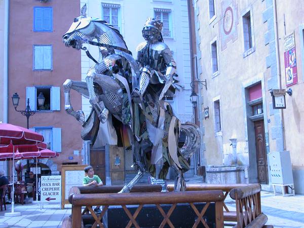 Metal sculpture of armored rider on rearing horse, Briançon town square
