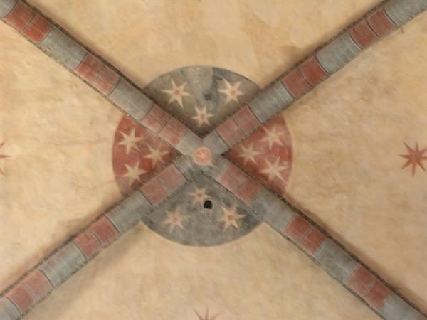 Frescoed vault crossing with stars, red and grey ribs