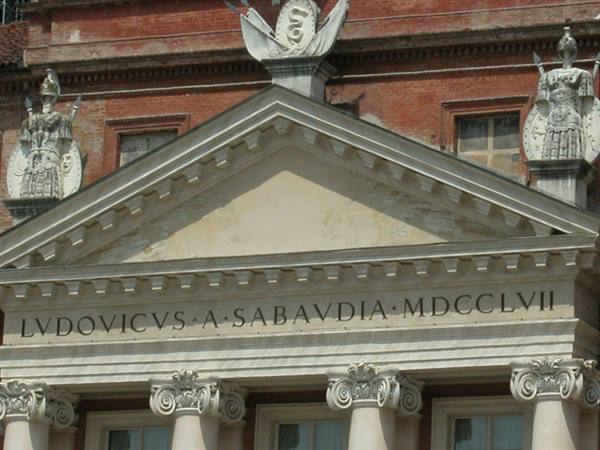 Racconigi Castle facade with pediment, statues and Latin inscription